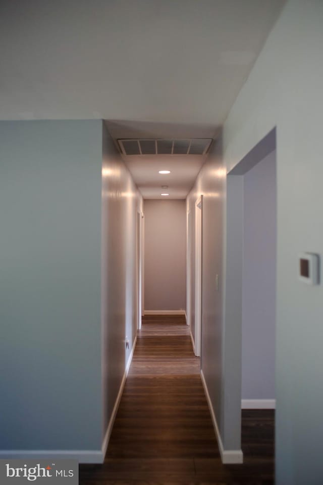 corridor with dark wood-type flooring