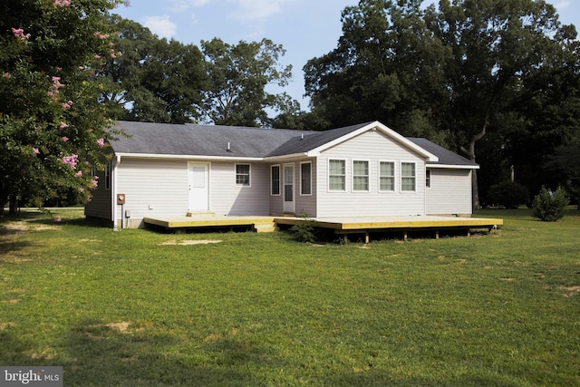 back of house with a yard and a deck