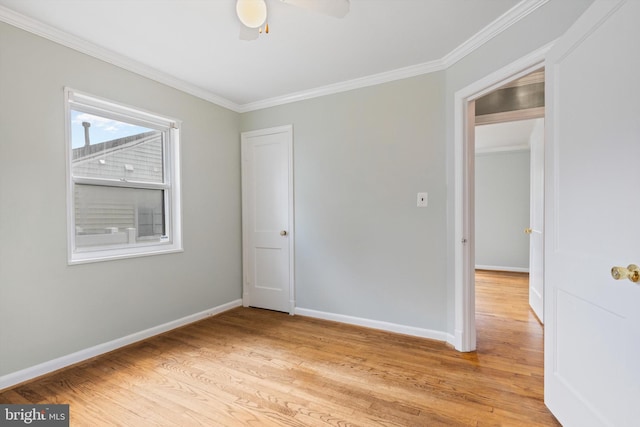 empty room featuring ceiling fan, ornamental molding, and light hardwood / wood-style floors