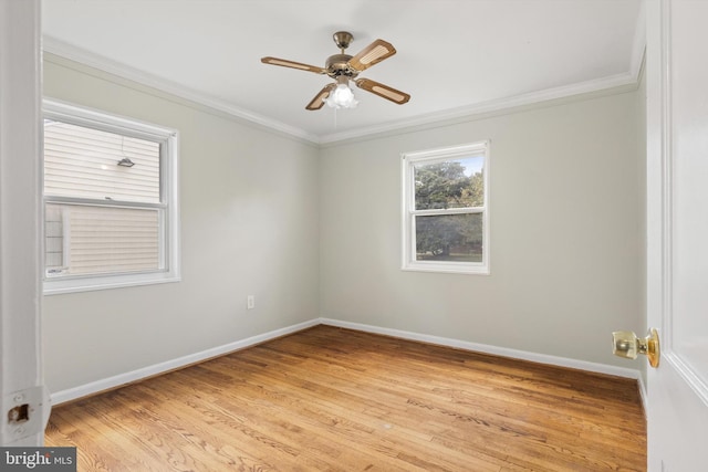 spare room with crown molding, light hardwood / wood-style flooring, and ceiling fan