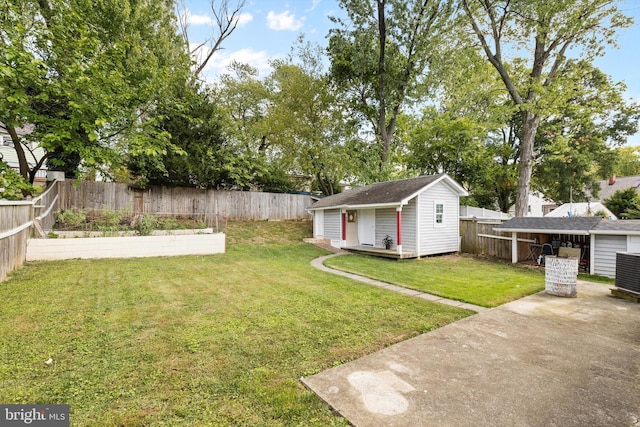 view of yard with an outbuilding and a patio