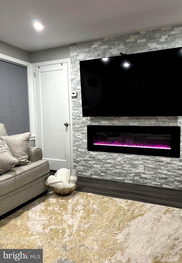 carpeted living room featuring a fireplace