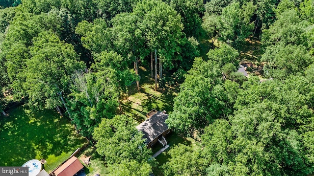 aerial view featuring a wooded view