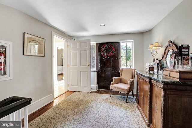 living area with hardwood / wood-style flooring