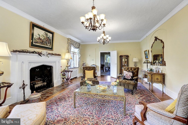 living room featuring ornamental molding, a chandelier, and hardwood / wood-style floors