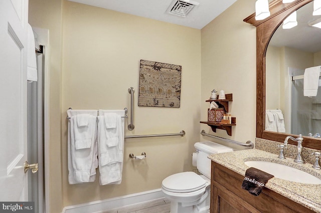 bathroom featuring vanity, toilet, wood-type flooring, and a shower with curtain