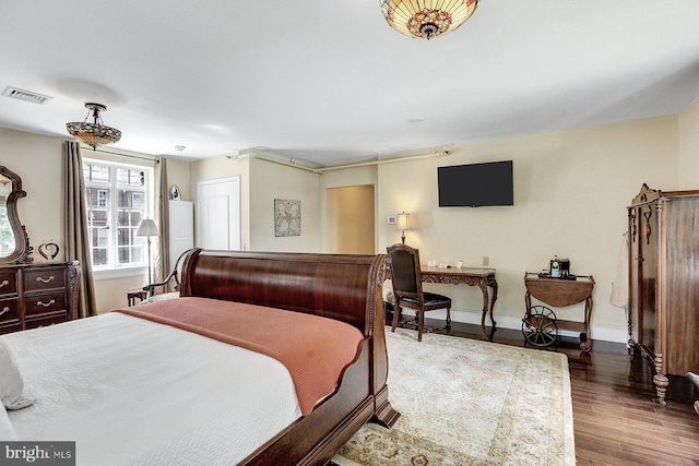 bedroom featuring dark hardwood / wood-style floors