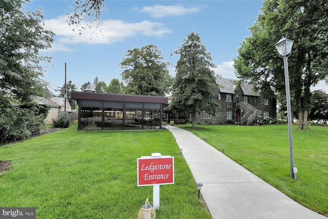 view of community with a yard and a carport