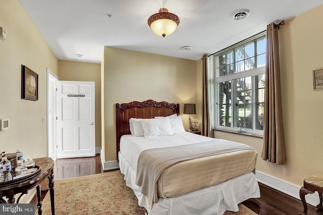 bedroom with wood-type flooring