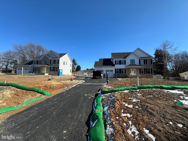 unfinished property featuring a garage