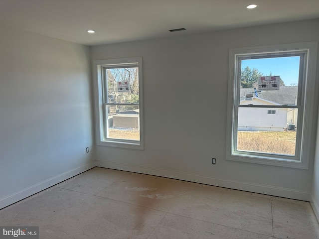 unfurnished room featuring visible vents, baseboards, and recessed lighting