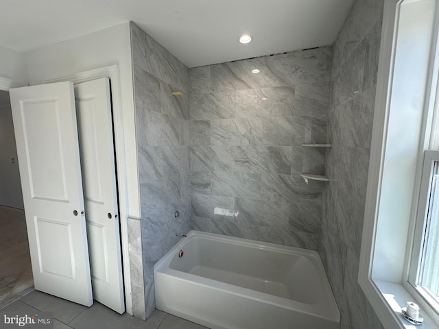 bathroom featuring tile patterned flooring and shower / bathing tub combination