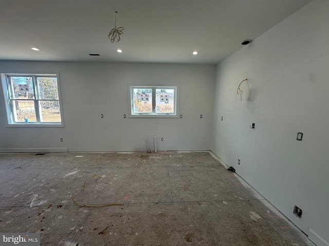 unfurnished room featuring a wealth of natural light and recessed lighting