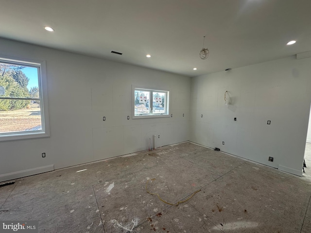 unfurnished room with visible vents and recessed lighting