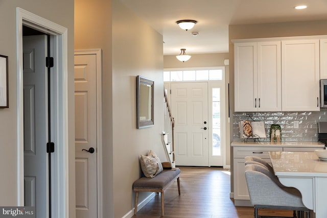 foyer entrance featuring light hardwood / wood-style flooring and plenty of natural light