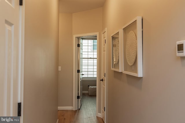 hall with light hardwood / wood-style floors