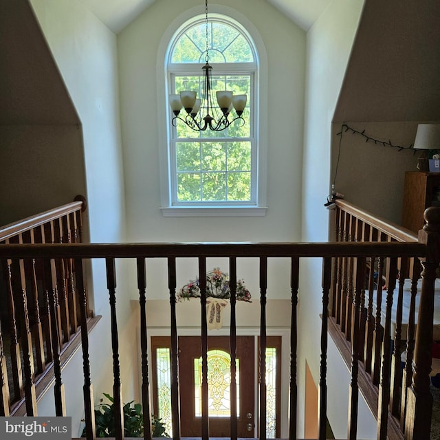 interior details featuring an inviting chandelier