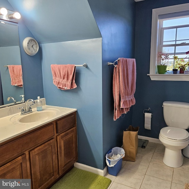 bathroom featuring vanity, toilet, and tile patterned floors