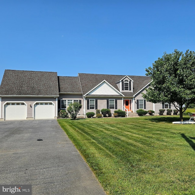 view of front facade featuring a garage and a front lawn