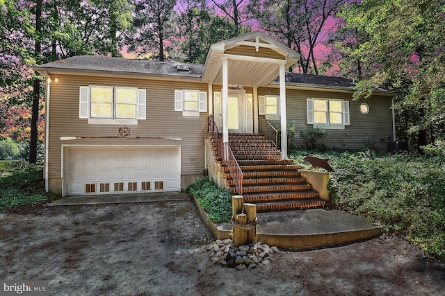 view of front of house with an attached garage and driveway