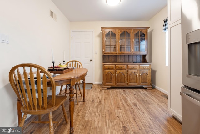 dining room with light hardwood / wood-style flooring