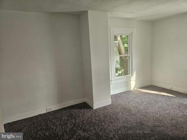 empty room with carpet flooring