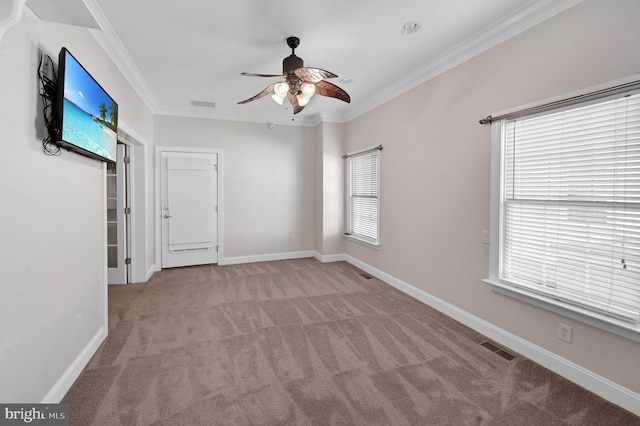 unfurnished bedroom with carpet floors, ceiling fan, and ornamental molding