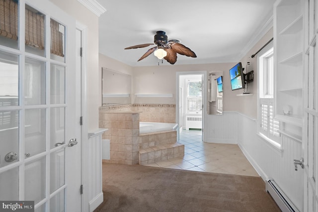 interior space featuring ceiling fan, crown molding, a baseboard radiator, and radiator