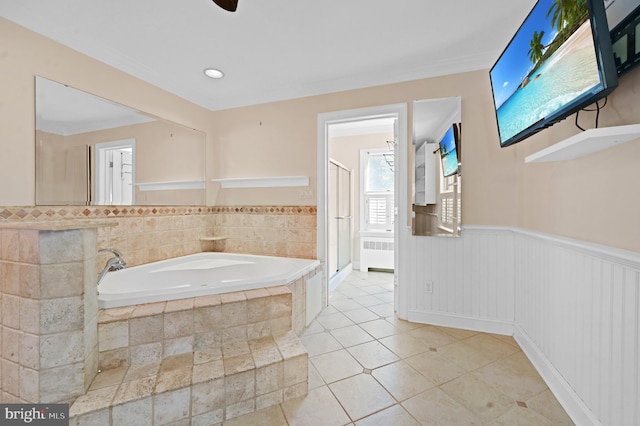 bathroom featuring radiator heating unit, tile patterned flooring, and shower with separate bathtub