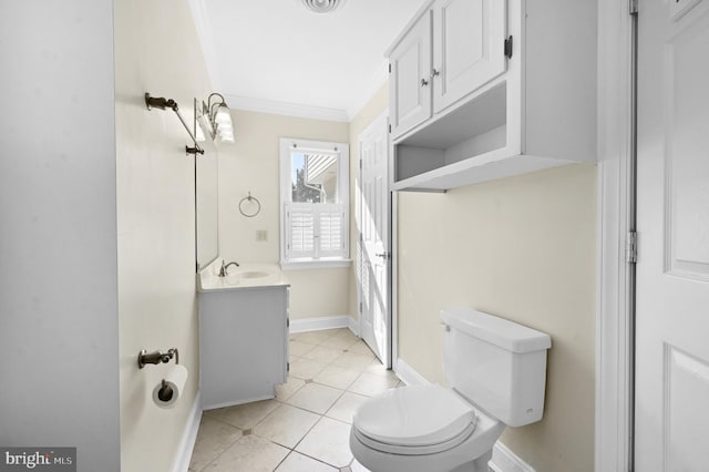 half bath featuring crown molding, toilet, vanity, baseboards, and tile patterned floors