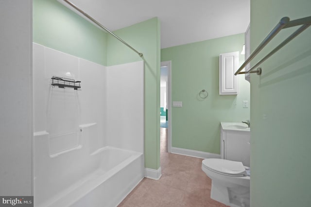 bathroom featuring bathing tub / shower combination, toilet, vanity, tile patterned flooring, and baseboards