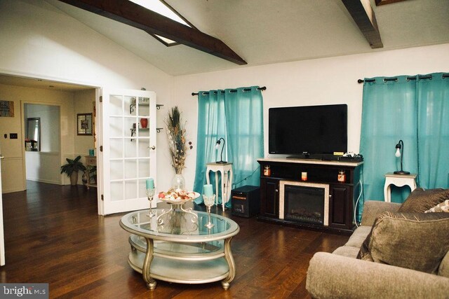 living room with a fireplace, dark wood-type flooring, and lofted ceiling with beams