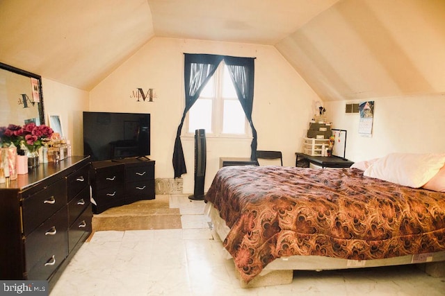 tiled bedroom with lofted ceiling