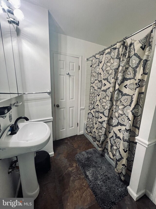 bathroom featuring tile patterned flooring and a shower with curtain