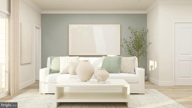 sitting room with light hardwood / wood-style floors and crown molding