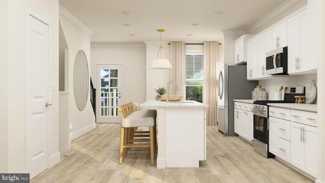 kitchen featuring stainless steel appliances, sink, pendant lighting, white cabinetry, and an island with sink