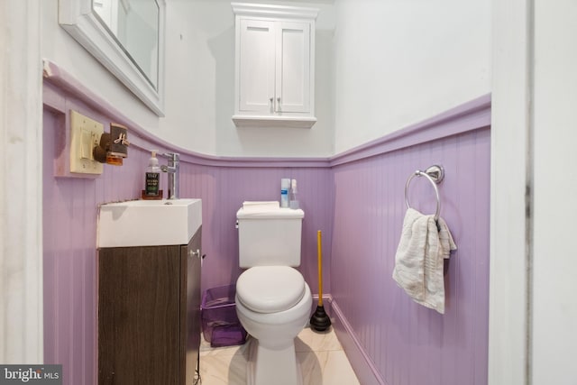 bathroom featuring tile patterned floors, toilet, and vanity