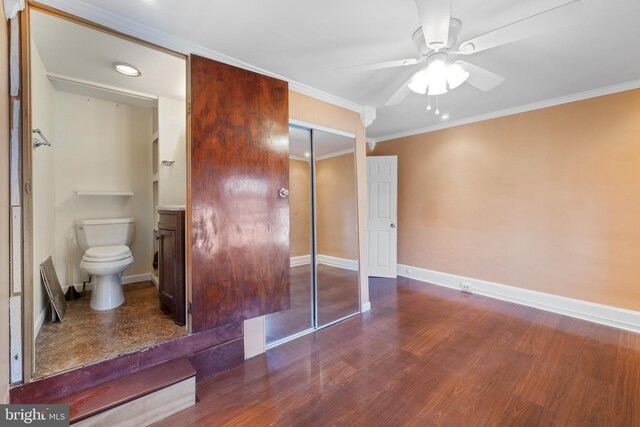 bathroom with ceiling fan, toilet, hardwood / wood-style flooring, and crown molding