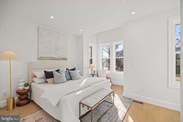 bedroom with light hardwood / wood-style flooring