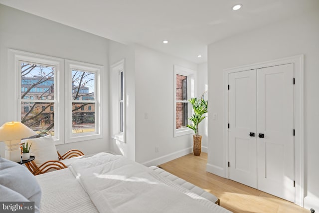 bedroom with light wood-type flooring