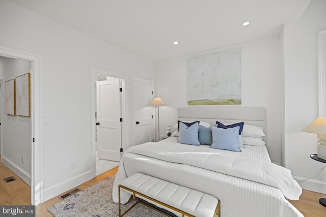 bedroom with light wood-type flooring