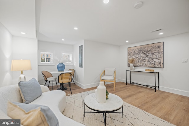 living room with light hardwood / wood-style flooring