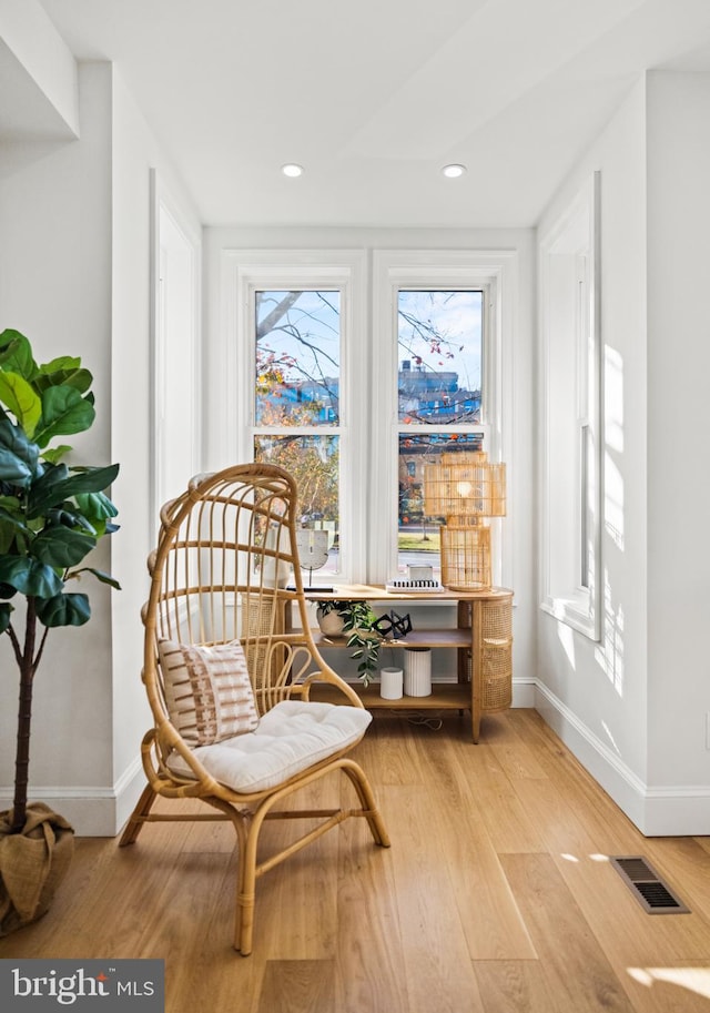 sitting room with hardwood / wood-style floors