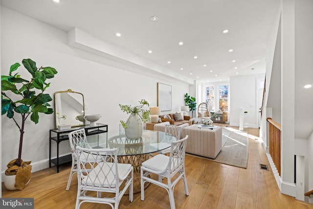 dining area featuring light wood-type flooring