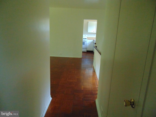 hallway featuring baseboards