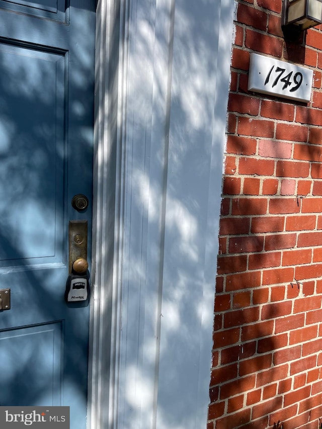 exterior details featuring brick siding