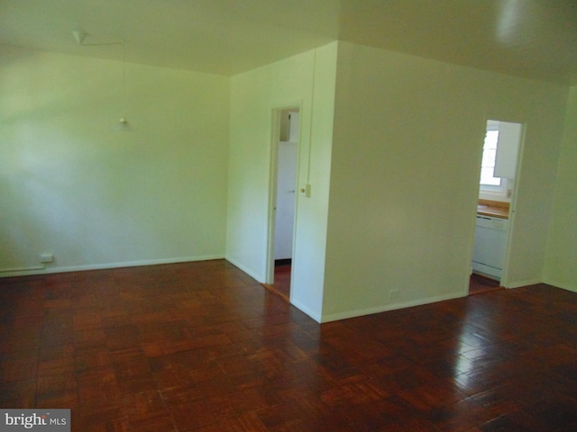 empty room featuring dark wood-type flooring