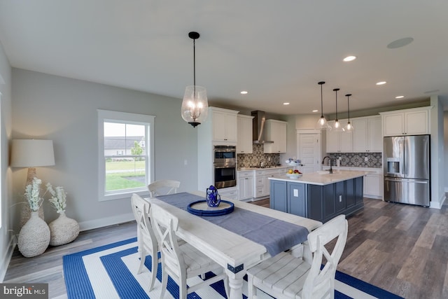 dining room with dark wood-type flooring, recessed lighting, and baseboards