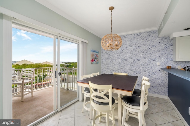 dining area with crown molding, a notable chandelier, light tile patterned floors, and french doors