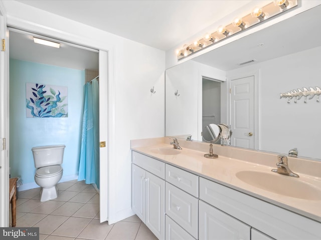 bathroom featuring vanity, toilet, a shower with shower curtain, and tile patterned flooring